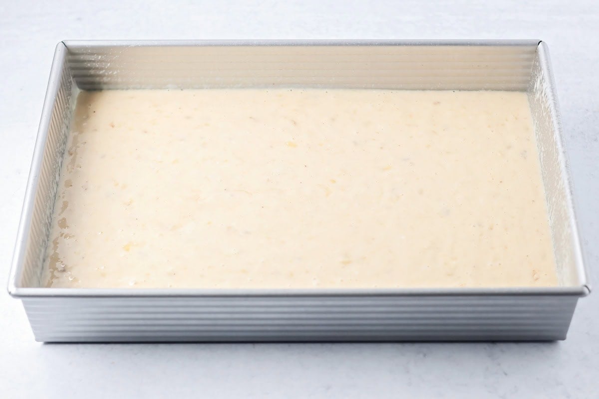 Batter for banana cake in a baking dish.