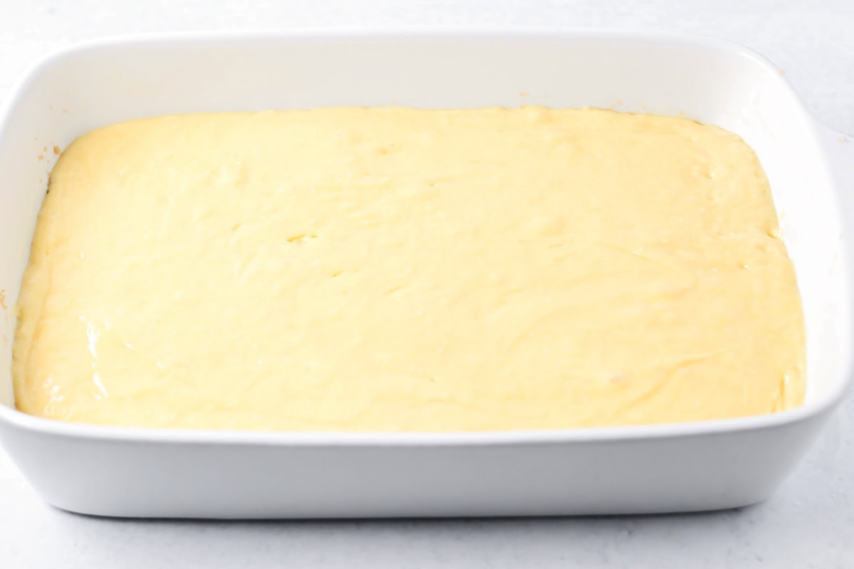 Cake batter in a baking dish.