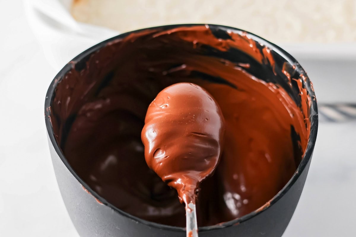 Melted chocolate in a pan for mounds bars.