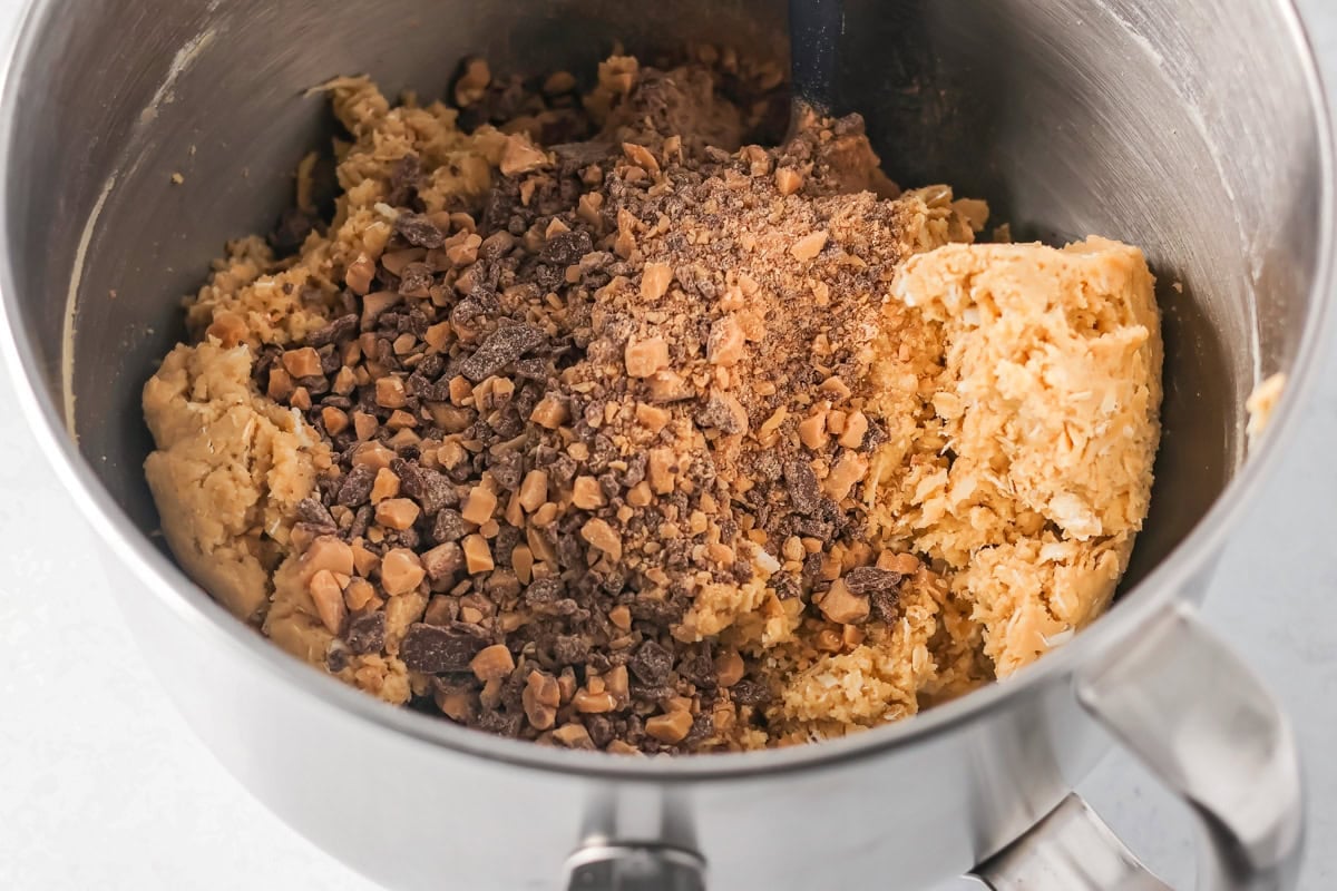 Adding toffee to the cookie batter.