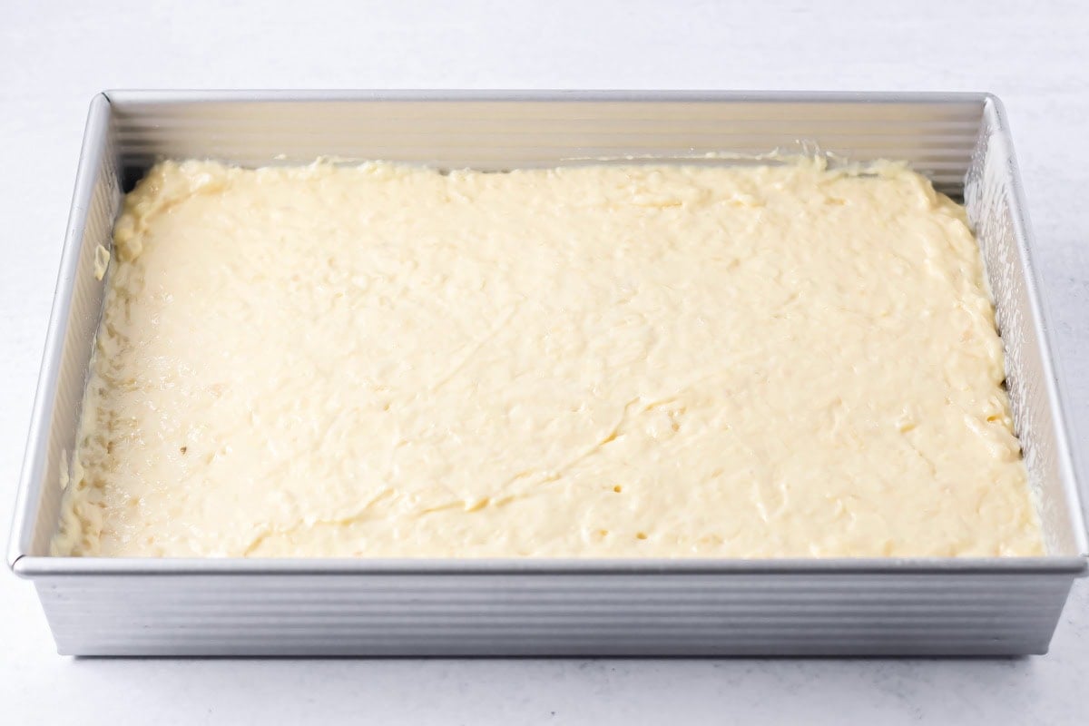 Pineapple cake batter in a baking dish.