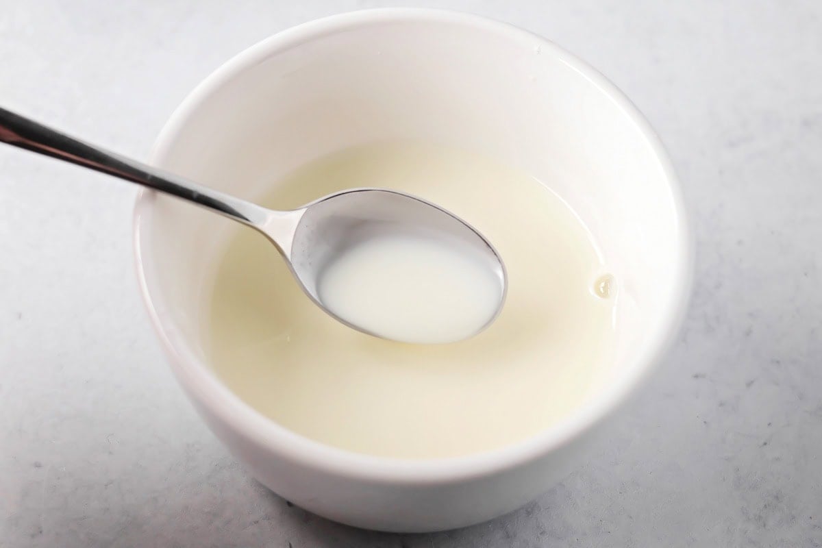 Cornstarch and water in a bowl to make a roux.