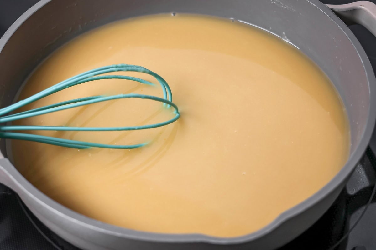 Making gravy in a pot for poutine.