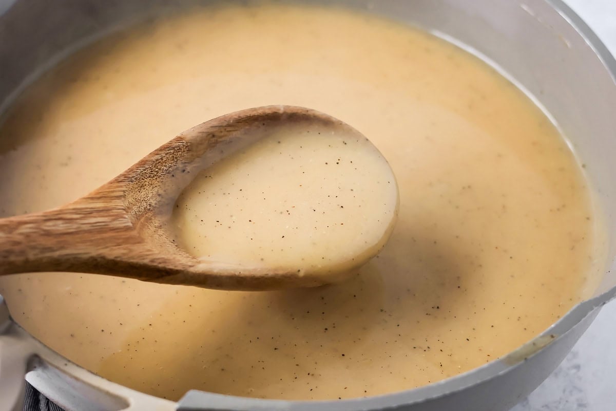 A pot of gravy for making poutine recipe.