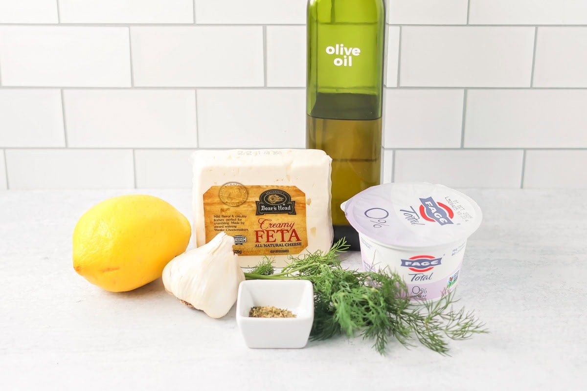 Ingredients for easy whipped feta on a kitchen counter.