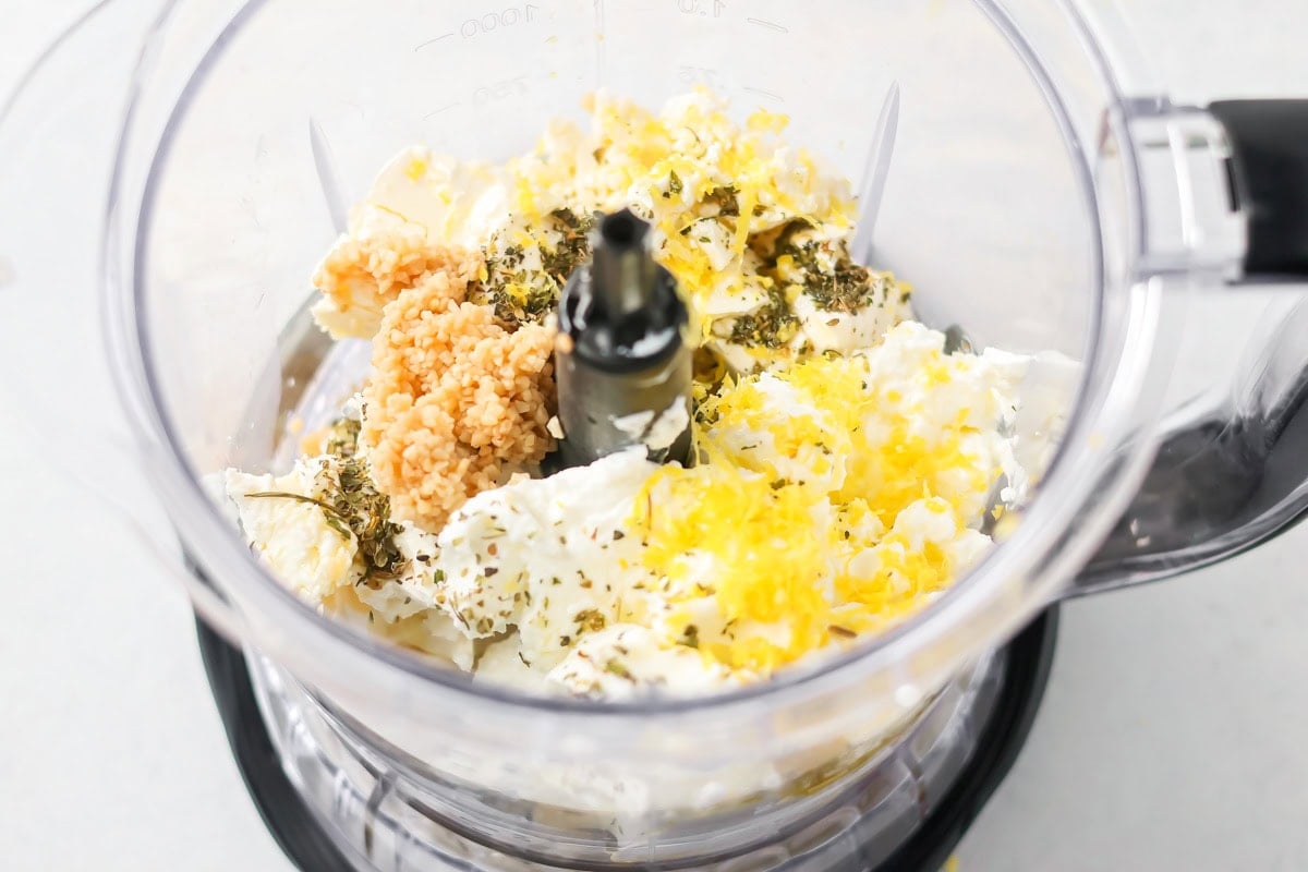 Ingredients for easy whipped feta in a food processor.