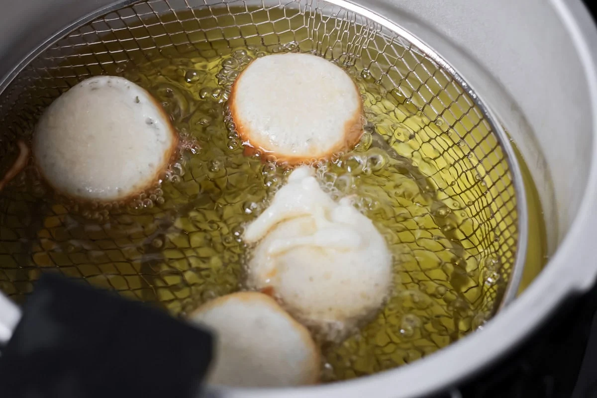 Oreos being fried in pancake batter.