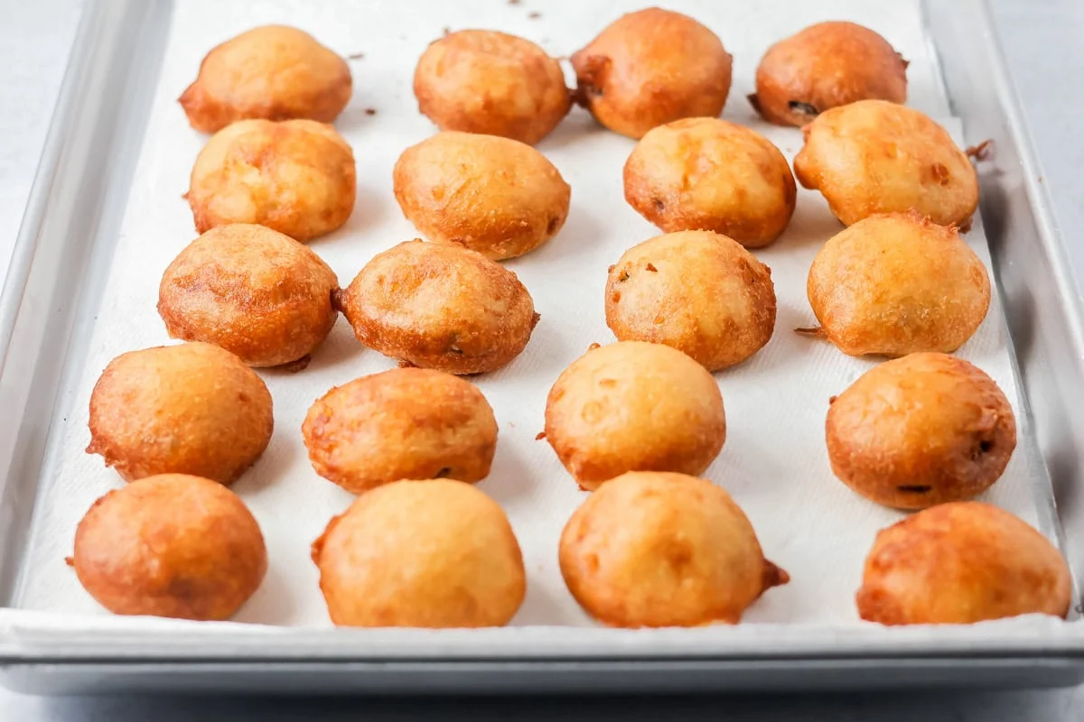 Fried Oreos draining on paper towels.