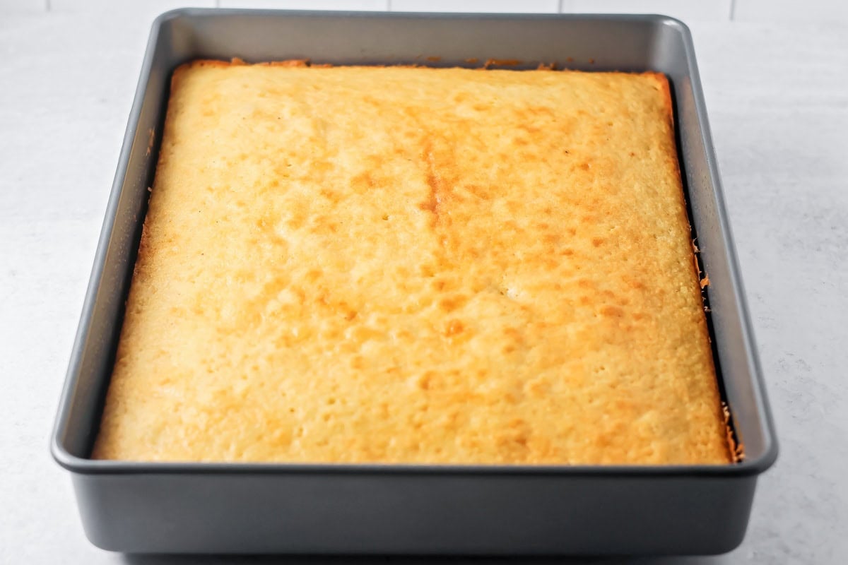 Baked buttermilk cake in a baking dish.