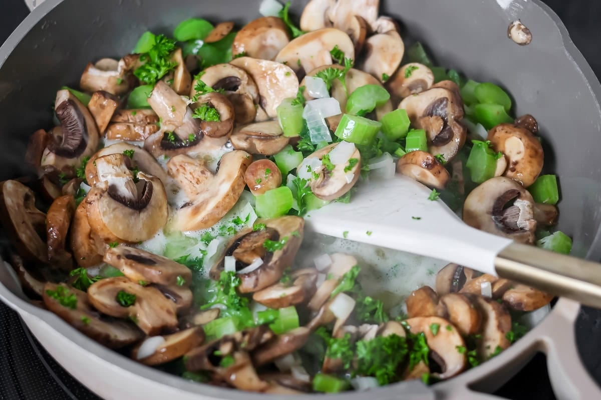 Vegetables for crock pot stuffing in a pan.