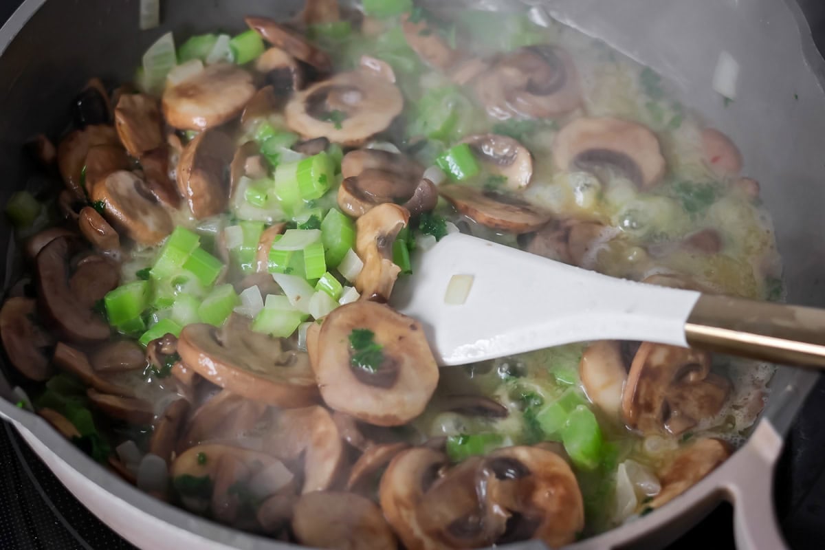 Sautéing vegetables for crock pot stuffing.