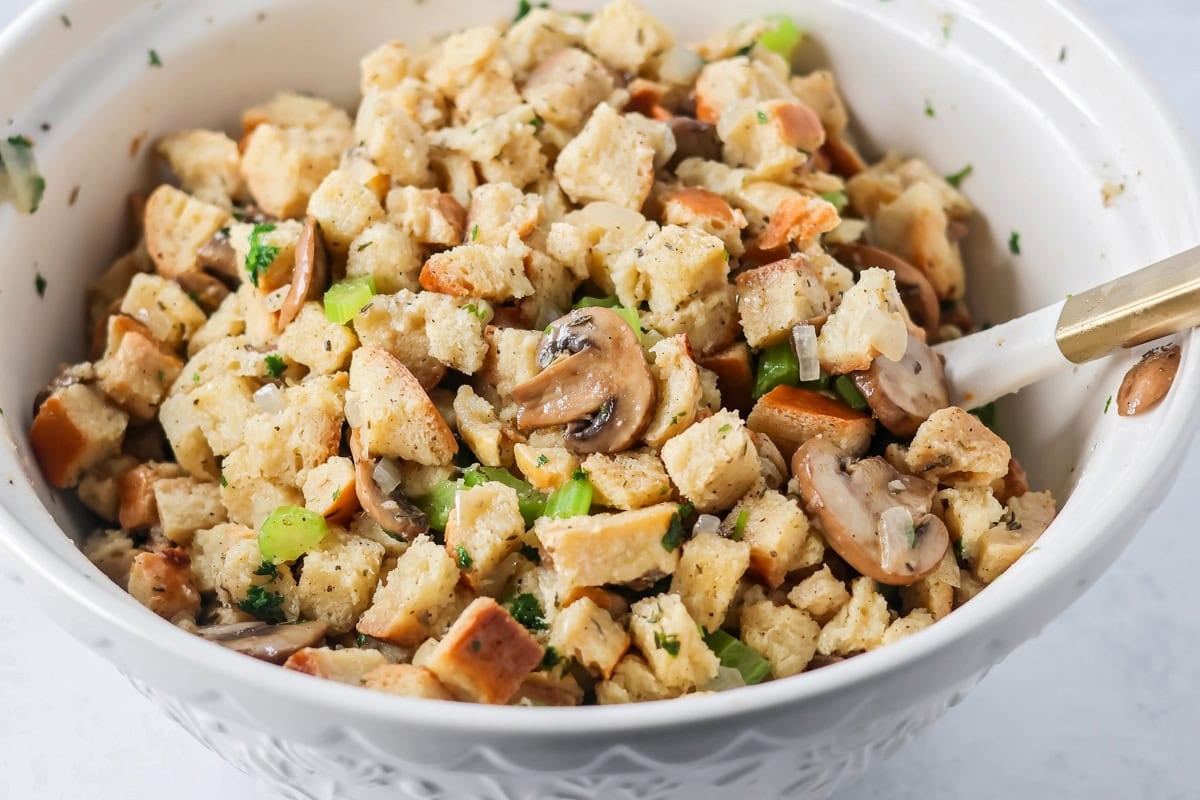 Mixing stuffing and gravy for crock pot stuffing recipe.