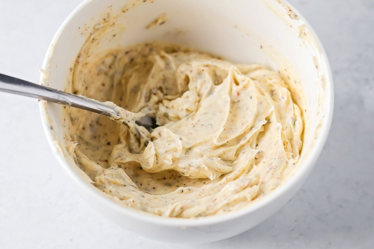 Mixing butter and seasonings for crock pot turkey.
