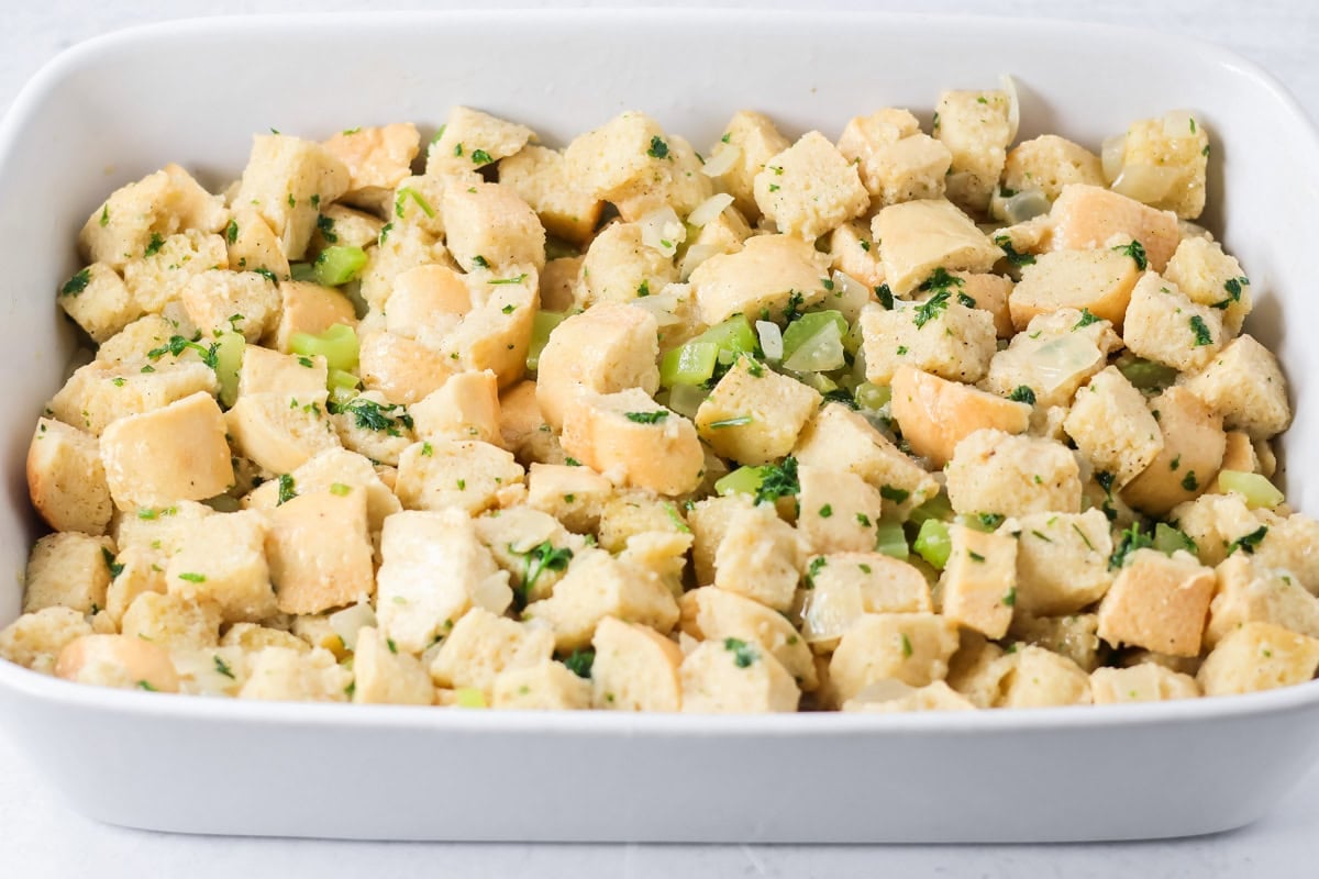 A baking dish of make ahead stuffing ready to be baked.