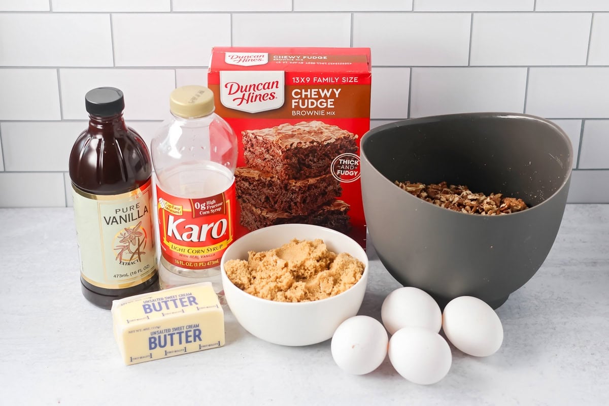Ingredients for pecan pie brownies on a kitchen counter.