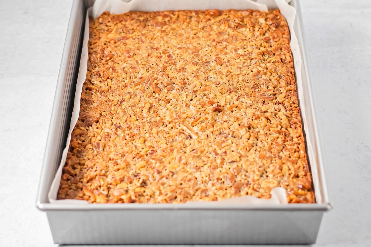 Baked pecan pie brownies in a baking dish.