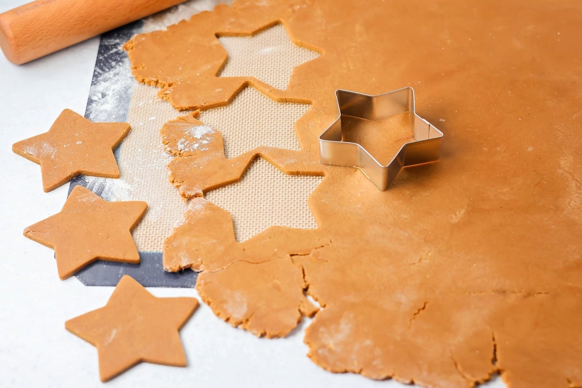 Cutting star shapes from rolled pepparkaka dough.