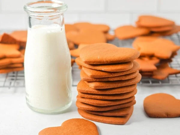 A stack of pepparkaka cookies served with milk.