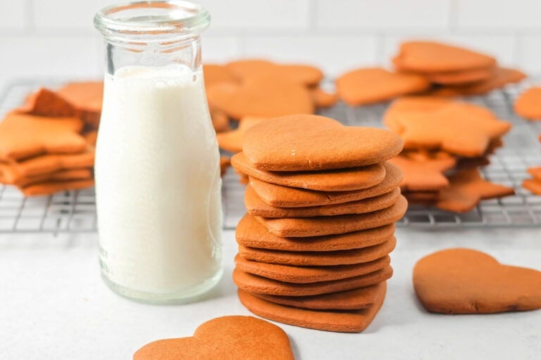 A stack of pepparkaka cookies served with milk.