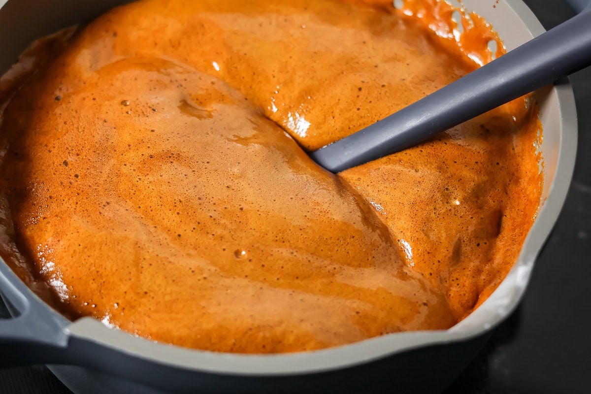 A foaming baking soda mixture in a pan for making pepparkaka dough.