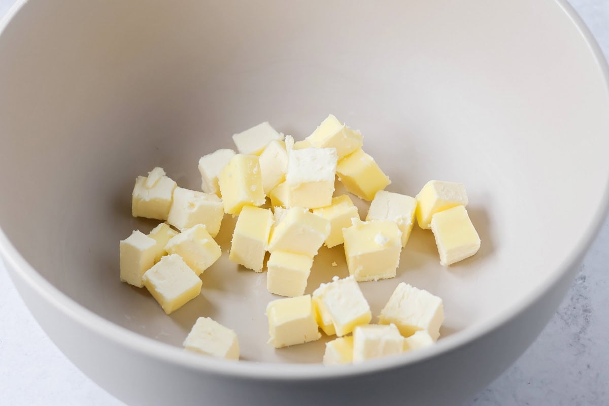 Cubed butter in a bowl to make pepperkaka dough.
