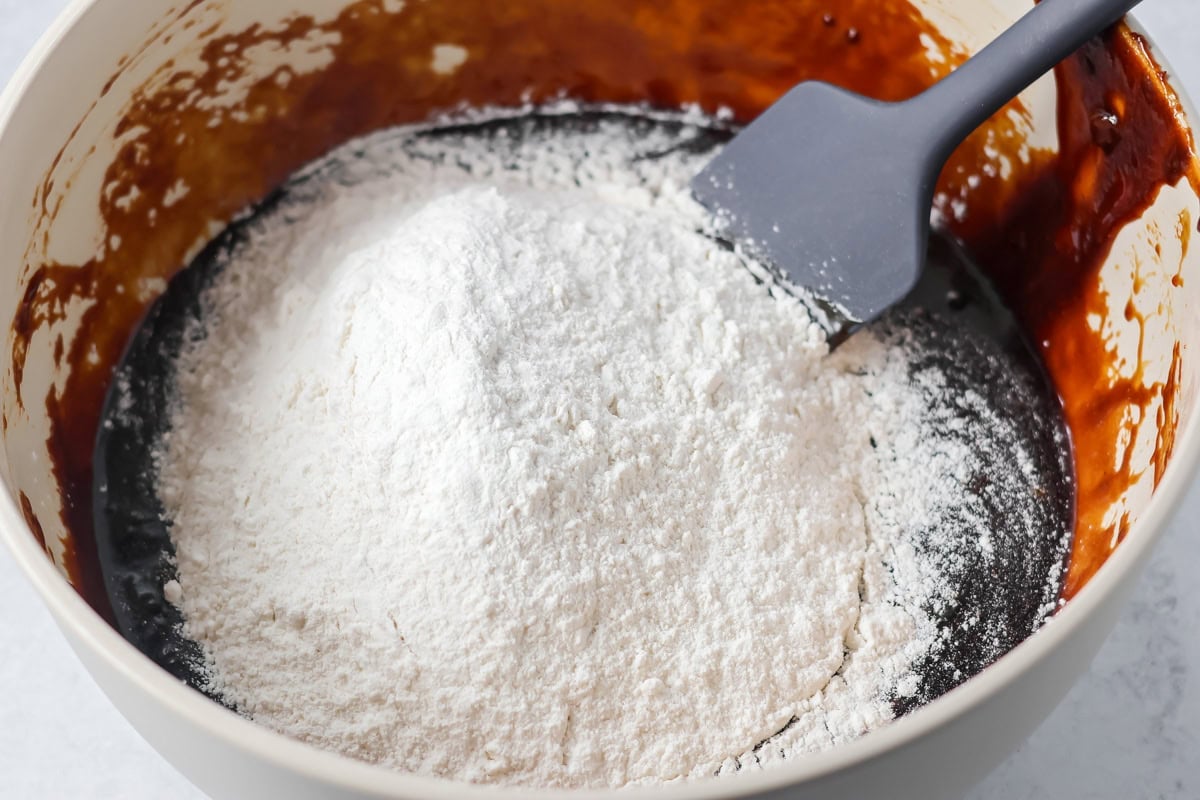 Adding flour to pepparkaka dough.