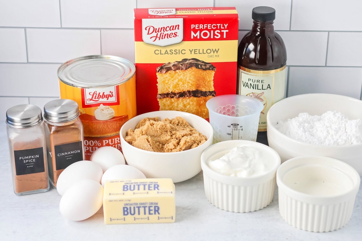 Ingredients for pumpkin honey bun cake on a kitchen counter.