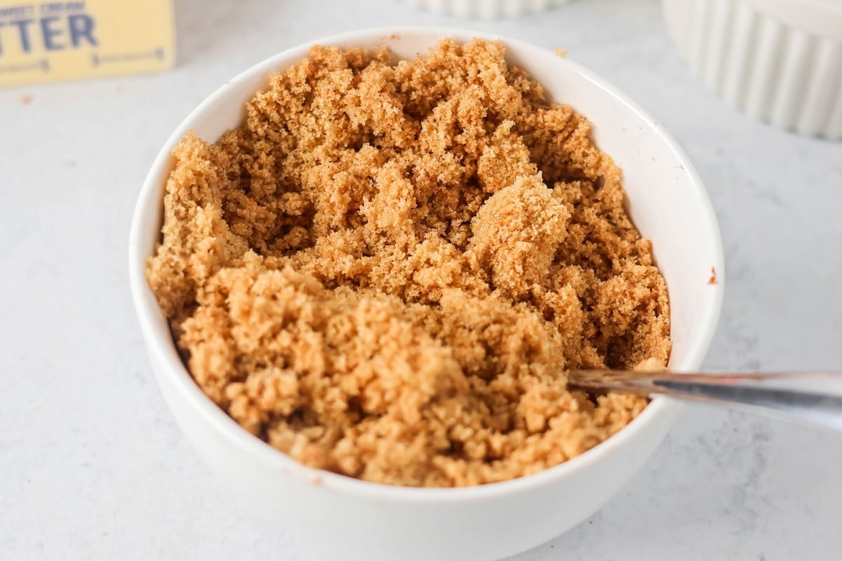 Brown sugar for pumpkin honey bun cake in a white bowl.