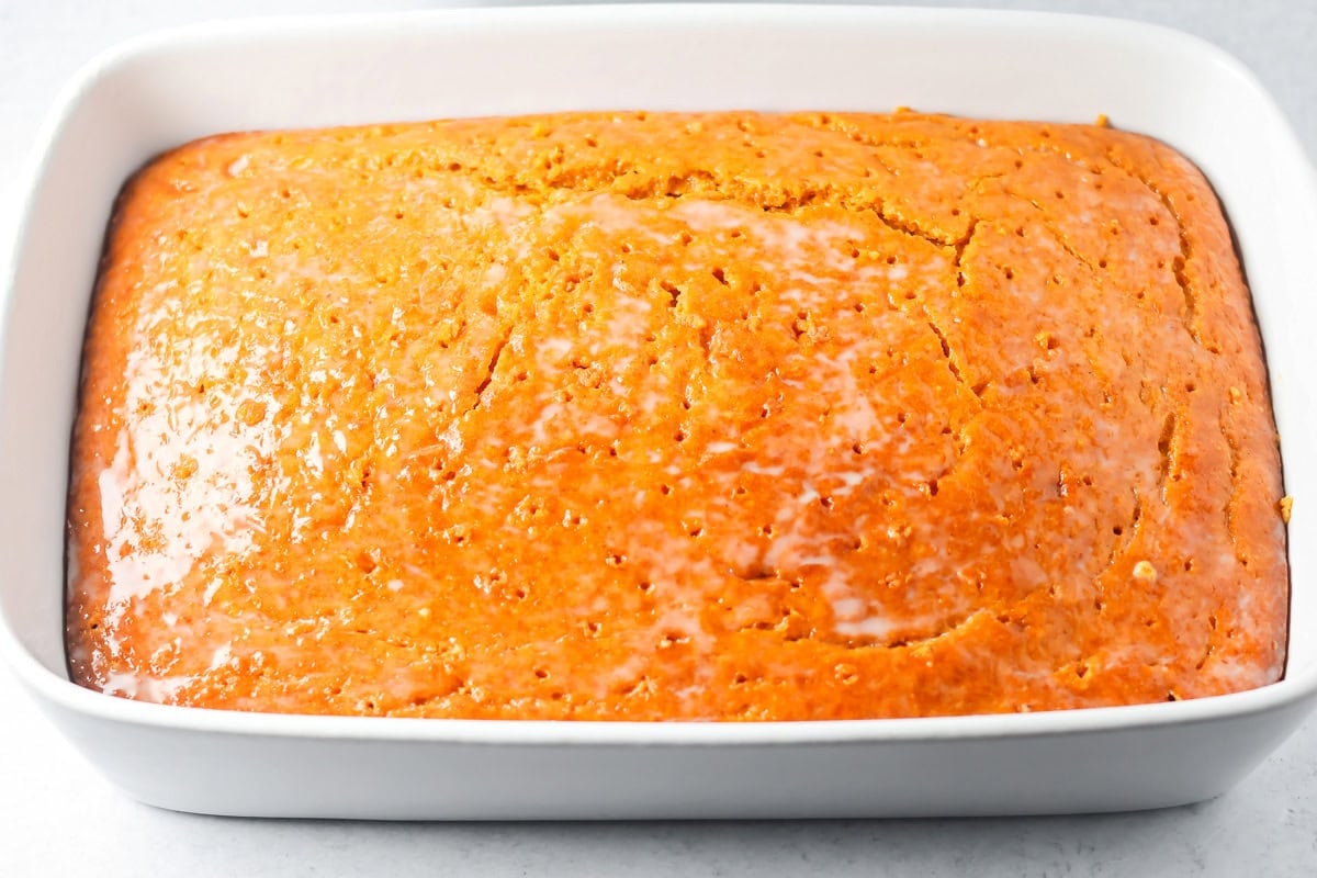 A baked pumpkin tres leches cake ready for topping.