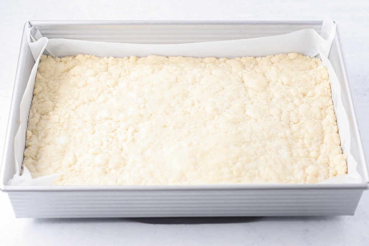 The baked crust for salted caramel cookie bars.