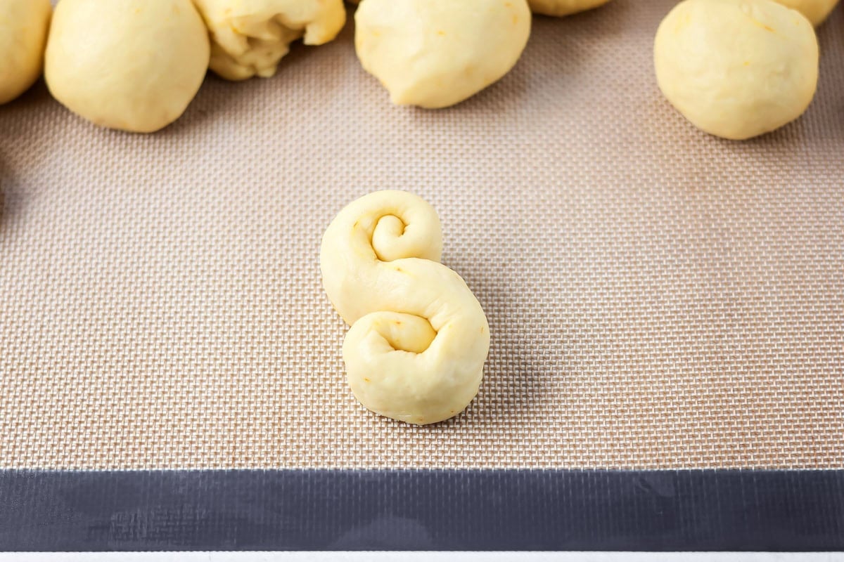 Shaping St. Lucia Buns into an S shape.