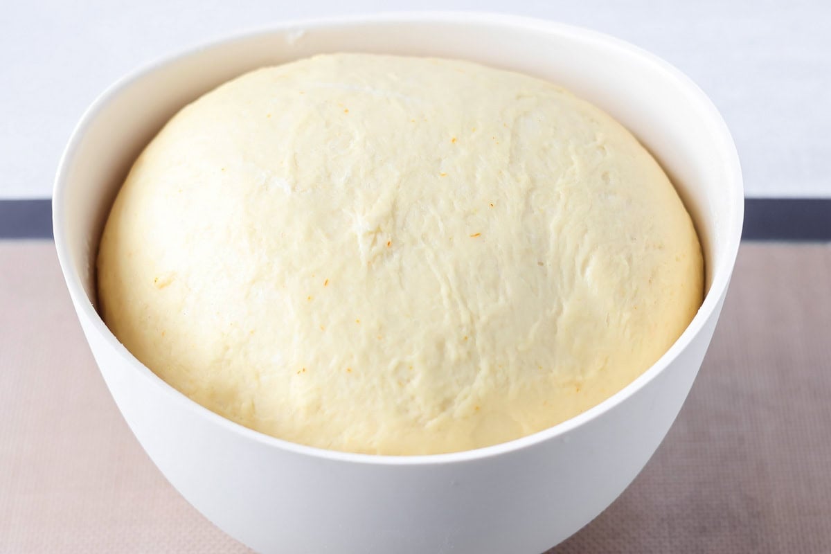St. Lucia Buns dough in a white bowl.