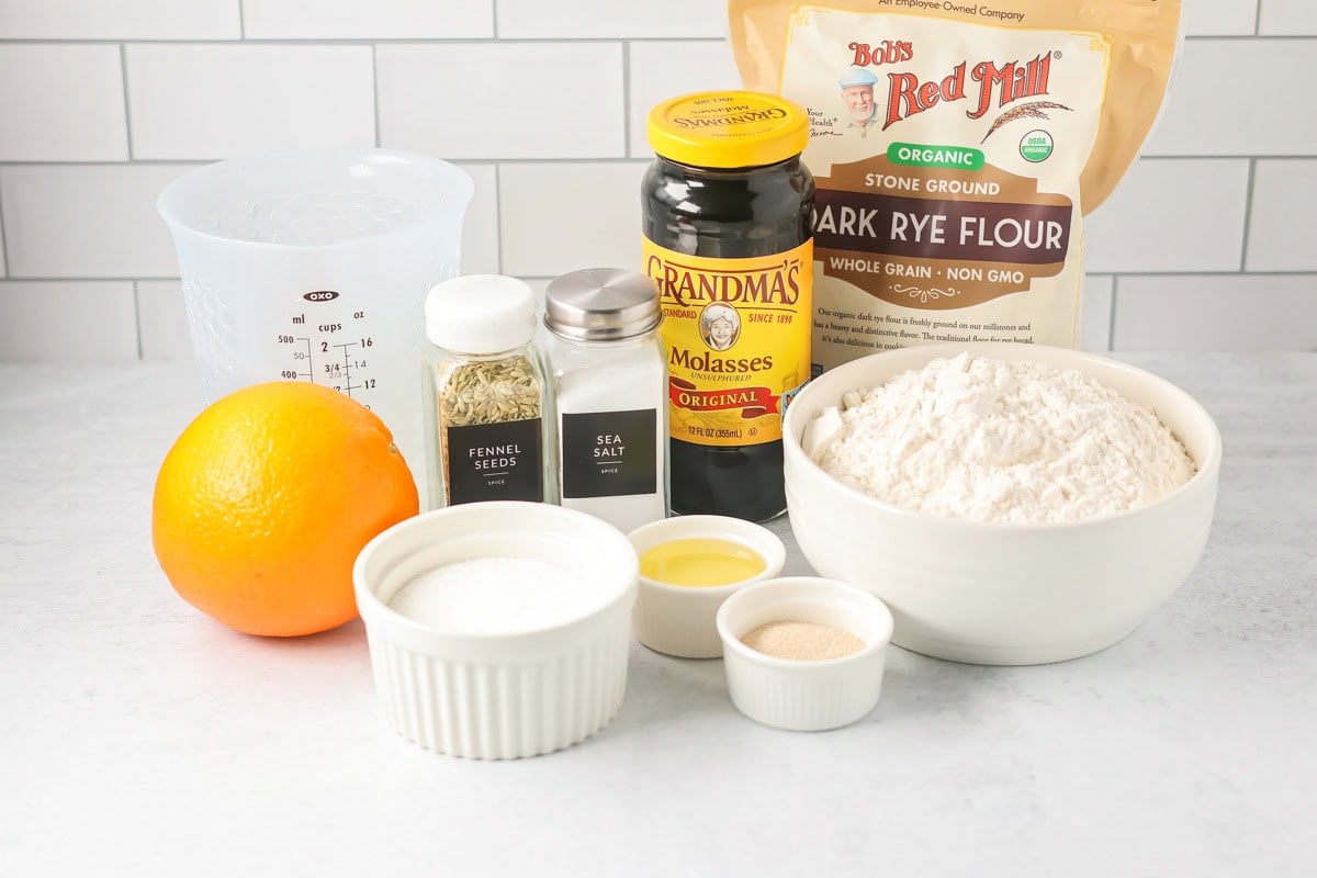 Ingredients for Swedish limpa bread on a kitchen counter.