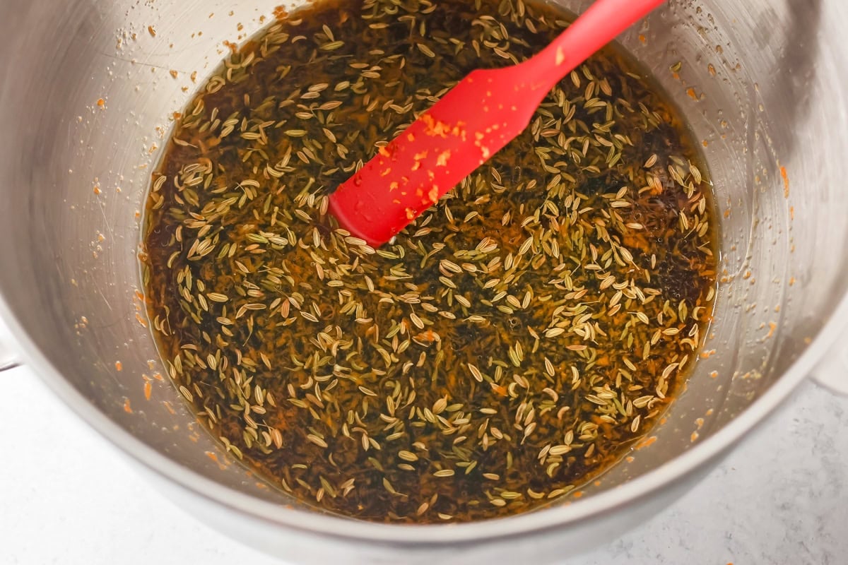 Spices and yest mixture in a bowl for making Swedish limpa bread.