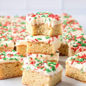 These Christmas Sugar Cookie Bars are soft, frosted, and festive, with vanilla almond flavor and an easy 9x13-inch bake for holiday parties.