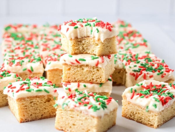 These Christmas Sugar Cookie Bars are soft, frosted, and festive, with vanilla almond flavor and an easy 9x13-inch bake for holiday parties.