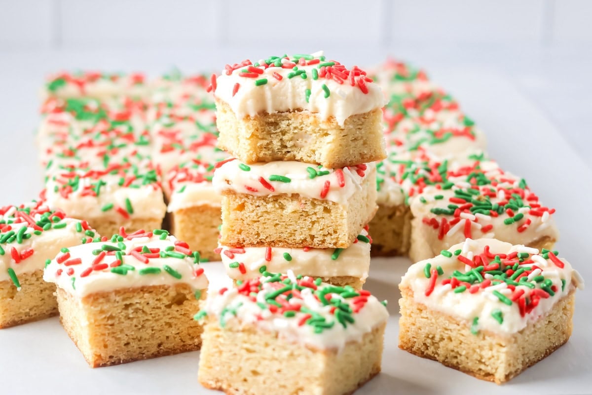 These Christmas Sugar Cookie Bars are soft, frosted, and festive, with vanilla almond flavor and an easy 9x13-inch bake for holiday parties.