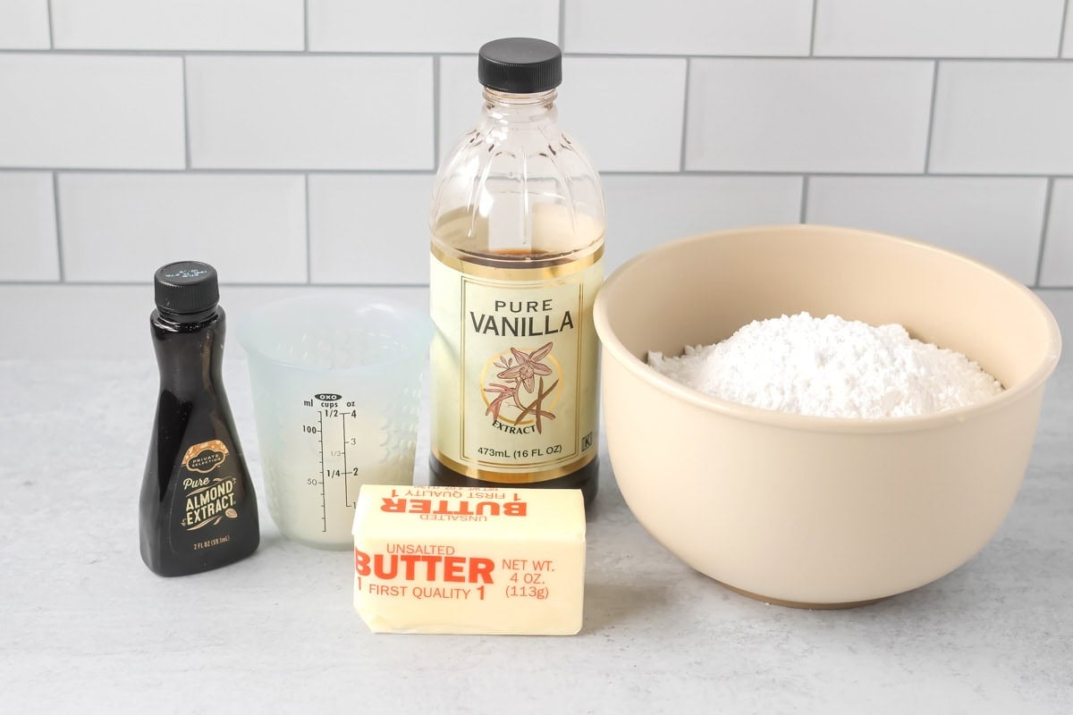 Frosting ingredients for Christmas sugar cookie bars on a kitchen counter.