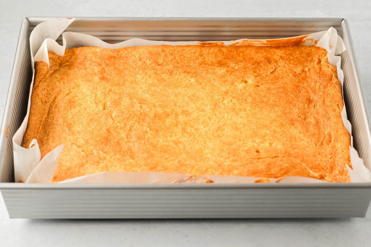 Baked Christmas sugar cookie bars in a baking dish.