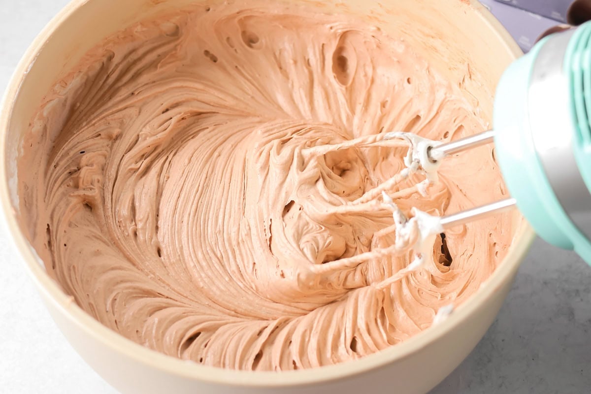 Whipping the filling in hot chocolate lasagna.
